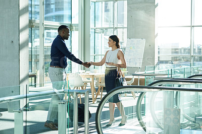 Buy stock photo Handshake, luggage and welcome with business people in office boardroom for friendly greeting or meeting. B2B, suitcase or travel with employee man and woman shaking hands for success in workplace