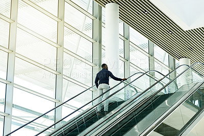 Buy stock photo Escalator, airport and business man for travel, commute and arrive in lobby for international trip. Modern building, professional and person on electric stairs for journey to convention or conference