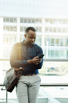 Buy stock photo Business, black man and typing with phone in office for meeting location, online booking and reading travel app. Professional, person and bag with smartphone for schedule or appointment information