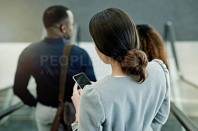 Buy stock photo Escalator, phone and travel with business people in airport from back for communication or trip. Booking, flight schedule and online check in on mobile with employee woman in terminal for departure