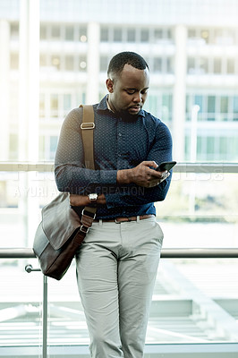 Buy stock photo Business, black man or typing with smartphone in office for interview location, web scroll or waiting for meeting. Professional, person or briefcase with phone for schedule or appointment information