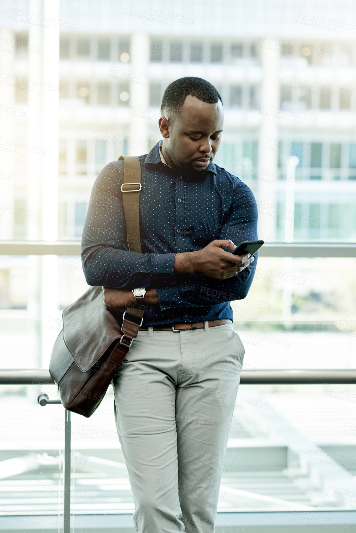 Buy stock photo Business, black man or typing with smartphone in office for interview location, web scroll or waiting for meeting. Professional, person or briefcase with phone for schedule or appointment information