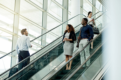 Buy stock photo Business, people or travel on escalator in lobby for morning commute, conference arrival or international expo. Professional, group or greeting on moving staircase for corporate journey or colleagues