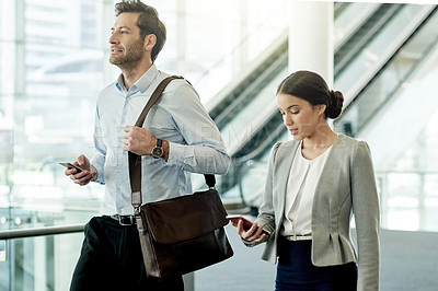 Buy stock photo Business people, phone and start of walking in office, chat and reading morning email for schedule. Employees, company news and online for communication in lobby, networking and workplace travel