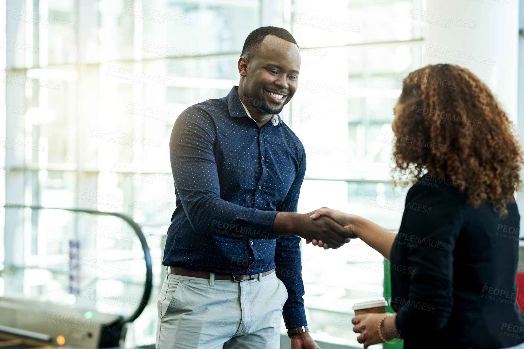 Buy stock photo Handshake, smile and welcome with business people in airport lobby for friendly greeting or meeting. B2B, escalator or travel with employee man and woman shaking hands for international partnership