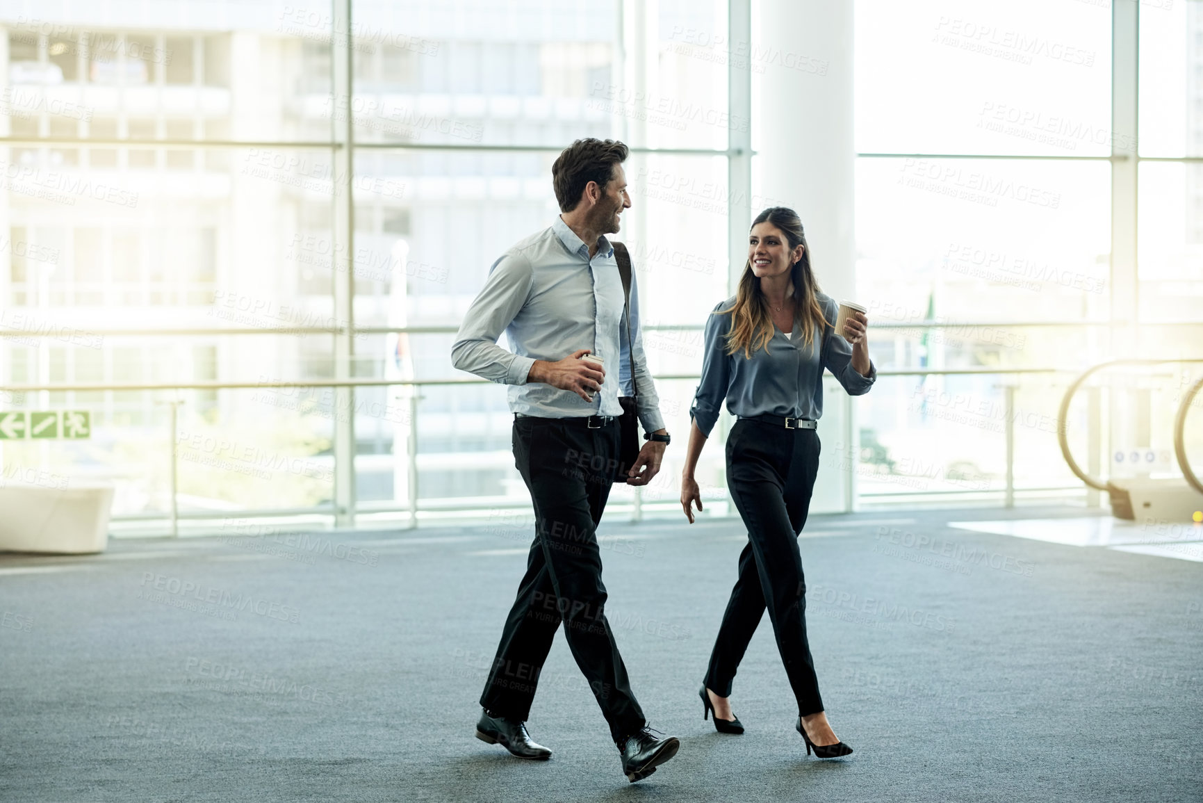 Buy stock photo Business, talking and people with walking in office for work arrival, friendly chat and company gossip. Professional, finance firm and employees with meeting break, networking and career discussion