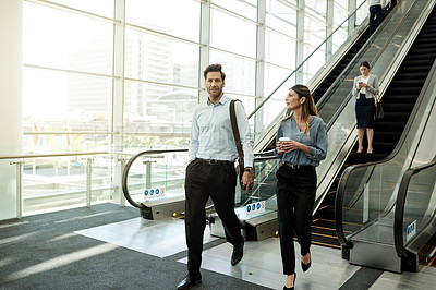 Buy stock photo Office, walking and business people in lobby for meeting, discussion and arrival at networking event. Professional, corporate and man and woman at conference, convention and seminar in building