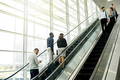 Buy stock photo Business, people and travel on escalator at airport for conference trip, flight arrival or international expo. Professional, group and luggage on moving staircase for corporate journey or departure