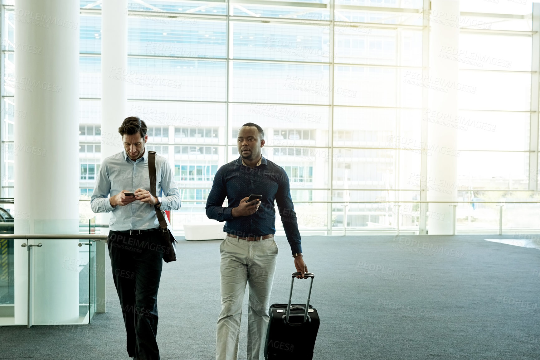 Buy stock photo Business people, phone and bag in airport for travel, international collaboration and contact. Corporate team, luggage and tech in terminal for trip planning, booking confirmation and flight schedule