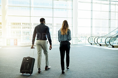 Buy stock photo Walking, airport and business people with luggage for travel, commute and arrival in lobby. International trip, conference and man and woman with suitcase for collaboration, meeting and convention