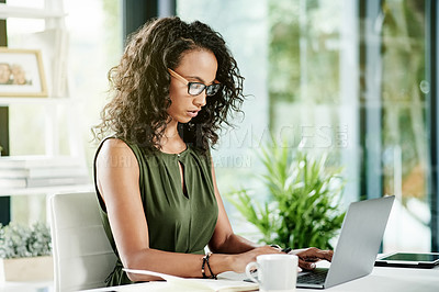 Buy stock photo Woman, laptop and typing in office for business, planning journal and reading article review. Journalist, glasses and computer in agency for creative opportunity, publishing project and trending news