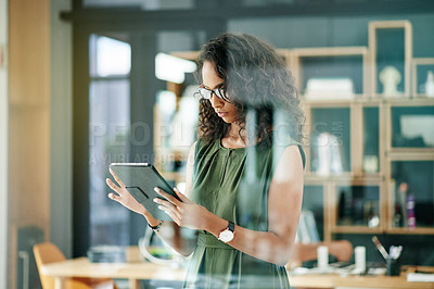 Buy stock photo Woman, tablet and reading at window for business, creative research and article review in forum. Journalist, tech and typing in office for email, news resources and information on internet for report