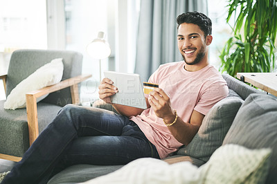 Buy stock photo Credit card, portrait and man on sofa on tablet for online shopping, internet purchase or payment in home. Ecommerce, fintech and person on digital tech for website sale, subscription and banking app