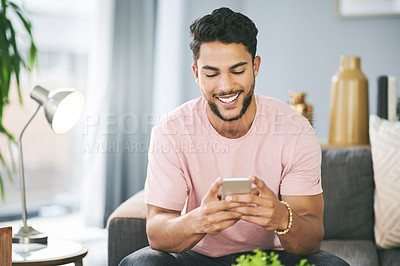 Buy stock photo House, smile and man on sofa, cellphone and typing with social media, texting and message to contact. Happy person, email and mobile user with smartphone, online reading and funny meme in living room