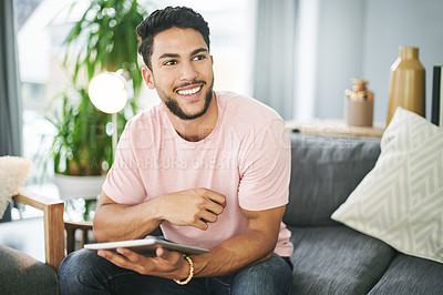 Buy stock photo Happy, tablet and man on sofa in home with online sports chat for fan polls with match update. Relax, digital technology and male person reading tournament results on blog in living room at house.