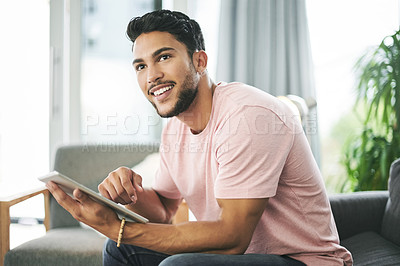Buy stock photo Thinking, tablet and man on sofa in home with online sports chat for fan polls with match update. Happy, digital technology and male person reading tournament results on blog in living room at house.