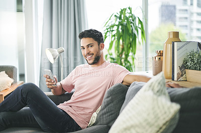 Buy stock photo Happy man, portrait and relax with phone on sofa for online research, social media or browsing web at home. Casual, male person or user with smile on mobile smartphone for interior or decor tips