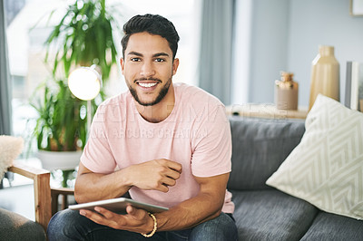 Buy stock photo Portrait, tablet and man on sofa in home with online sports chat for fan polls with match update. Happy, digital technology and male person reading tournament results on blog in living room at house.