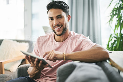 Buy stock photo Man, portrait and relax on sofa with tablet, social media or comfort with online banking in home. Person, chill or technology on couch for streaming platform, ecommerce app review or forum discussion
