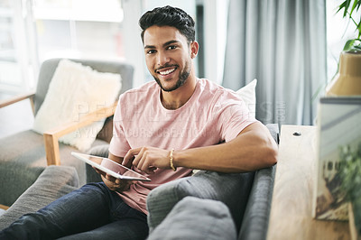 Buy stock photo Happy man, portrait and relax on sofa with tablet, social media or comfort with online banking in home. Person, chill or tech on couch for streaming platform, ecommerce app review or forum discussion