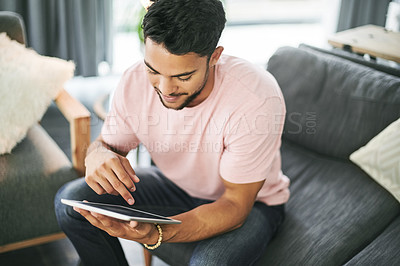 Buy stock photo Happy man, browsing or sofa with tablet for furniture, new interior or DIY tips in living room at home. Casual, male person or user scrolling on technology with smile for online decor store or design