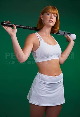 Buy stock photo Hockey, stick and woman thinking in studio for sport, workout challenge and training for game. Female athlete, redhead and equipment in green background for practice, competition and fitness concert