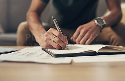Buy stock photo Bills, sofa and hands of man writing finance notes with invoice, home budget and income tax report. Financial plan, management and person on couch with notebook, paperwork and insurance application