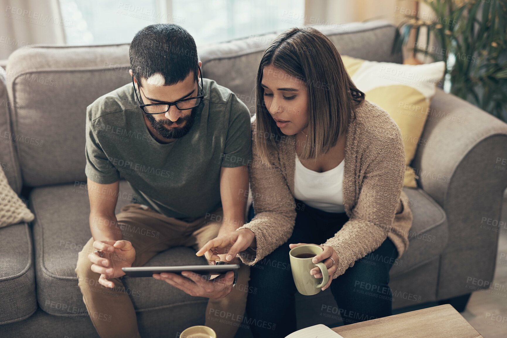 Buy stock photo Sofa, online and couple with tablet in home for social media, website and online shopping. Relax, dating and man and woman on digital tech with coffee for internet, news and videos in living room