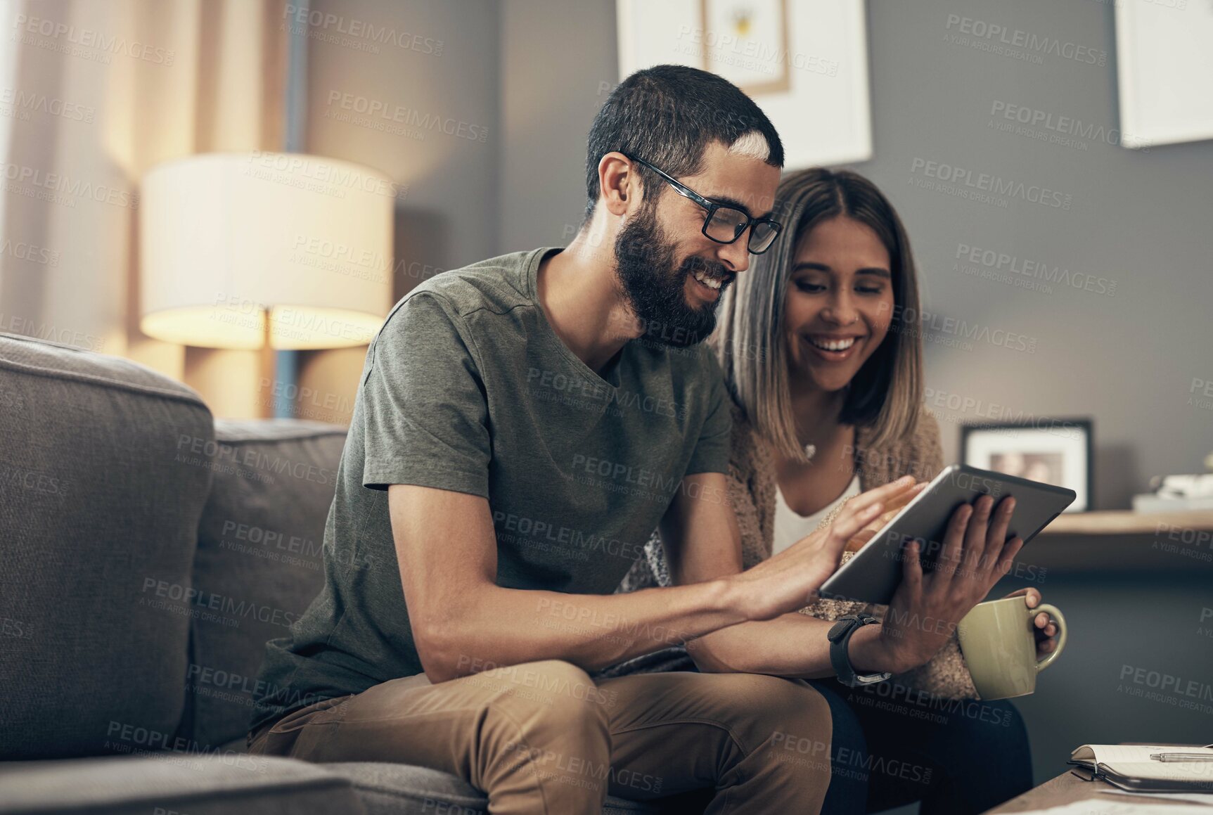 Buy stock photo Sofa, happy and couple with tablet in home for social media, website and online shopping. Relax, dating and man and woman on digital tech with coffee for internet, news and videos in living room