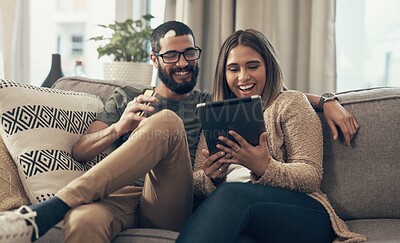 Buy stock photo Sofa, relax and couple with tablet in home for social media, website and online shopping. Happy, dating and man and woman on digital tech for internet, bonding and watching videos in living room