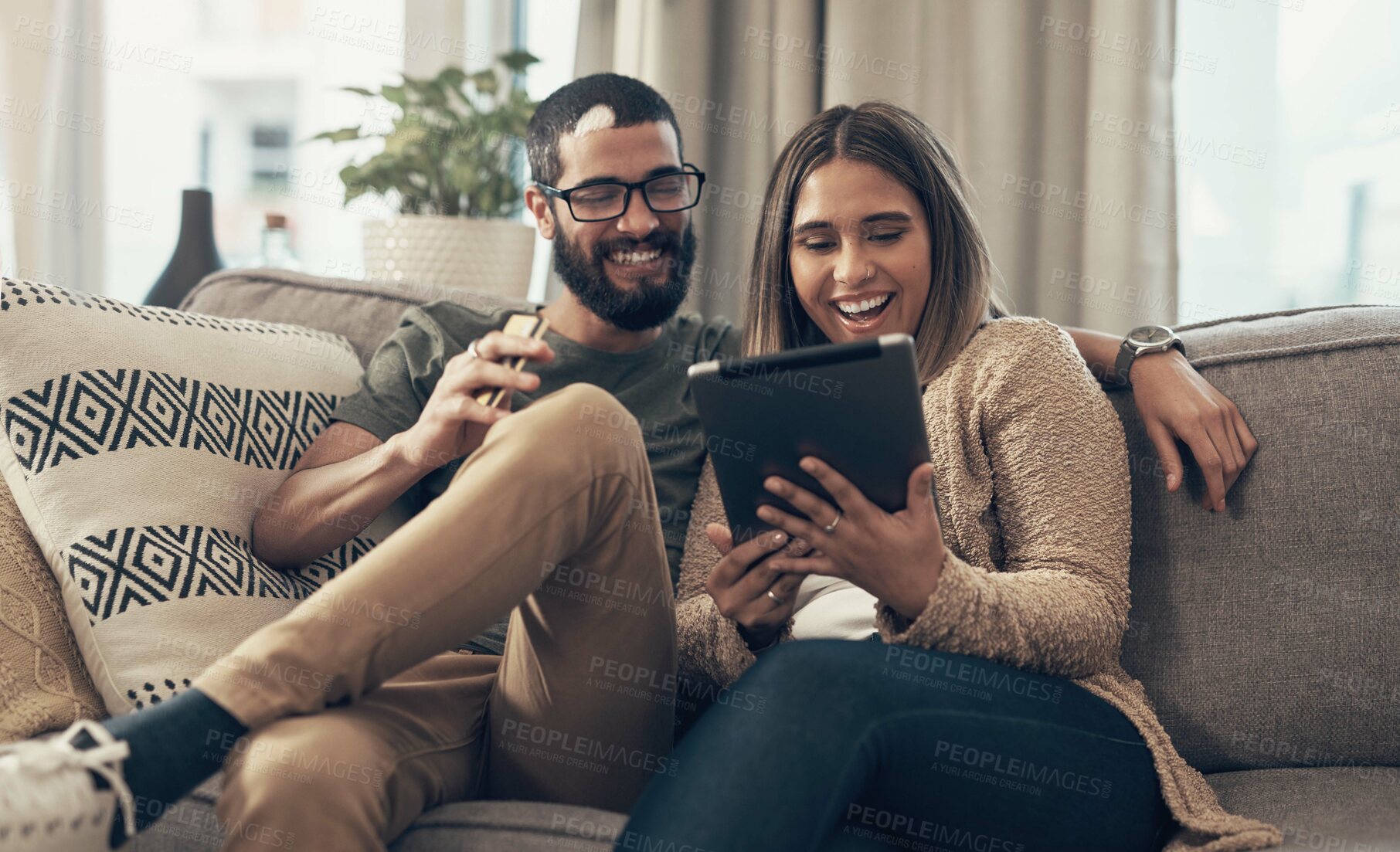 Buy stock photo Sofa, relax and couple with tablet in home for social media, website and online shopping. Happy, dating and man and woman on digital tech for internet, bonding and watching videos in living room