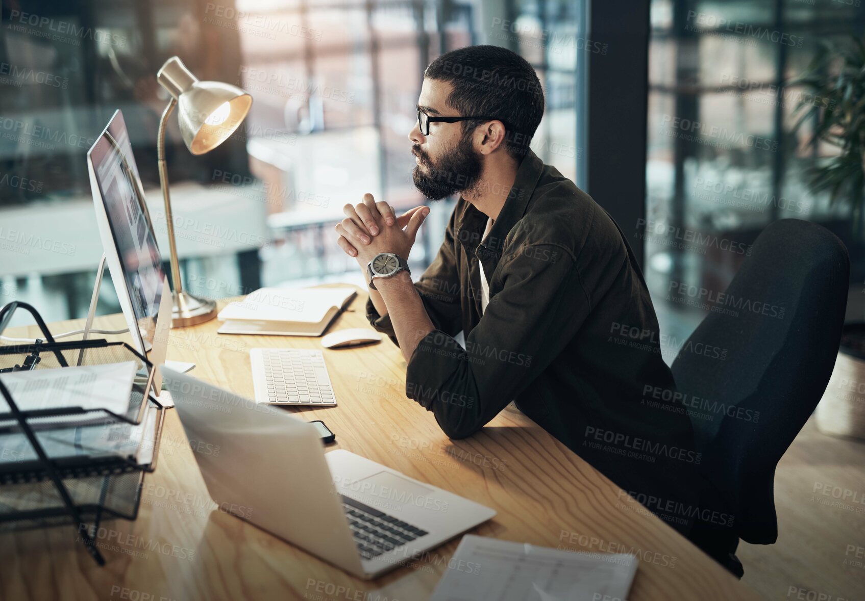 Buy stock photo Computer, thinking and planning with business man in office for web designer, ux tools or research. Coding homepage, night and developer with person in agency for cms platform, glasses and reading