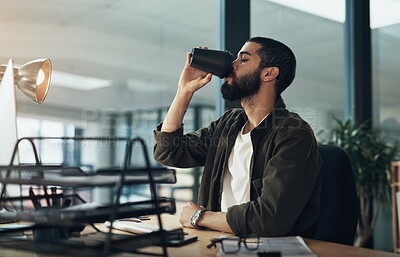Buy stock photo Business man, coffee and drink at night for deadline with creative copywriter on computer for social media idea. Employee, beverage and person in startup office on overtime with espresso or takeaway
