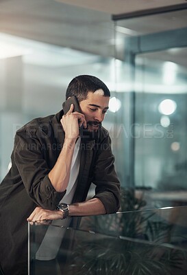 Buy stock photo Creative, designer and man with phone call in startup with client for feedback, project update and task. Night, overtime and male person on mobile communication for content approval,  and negotiation