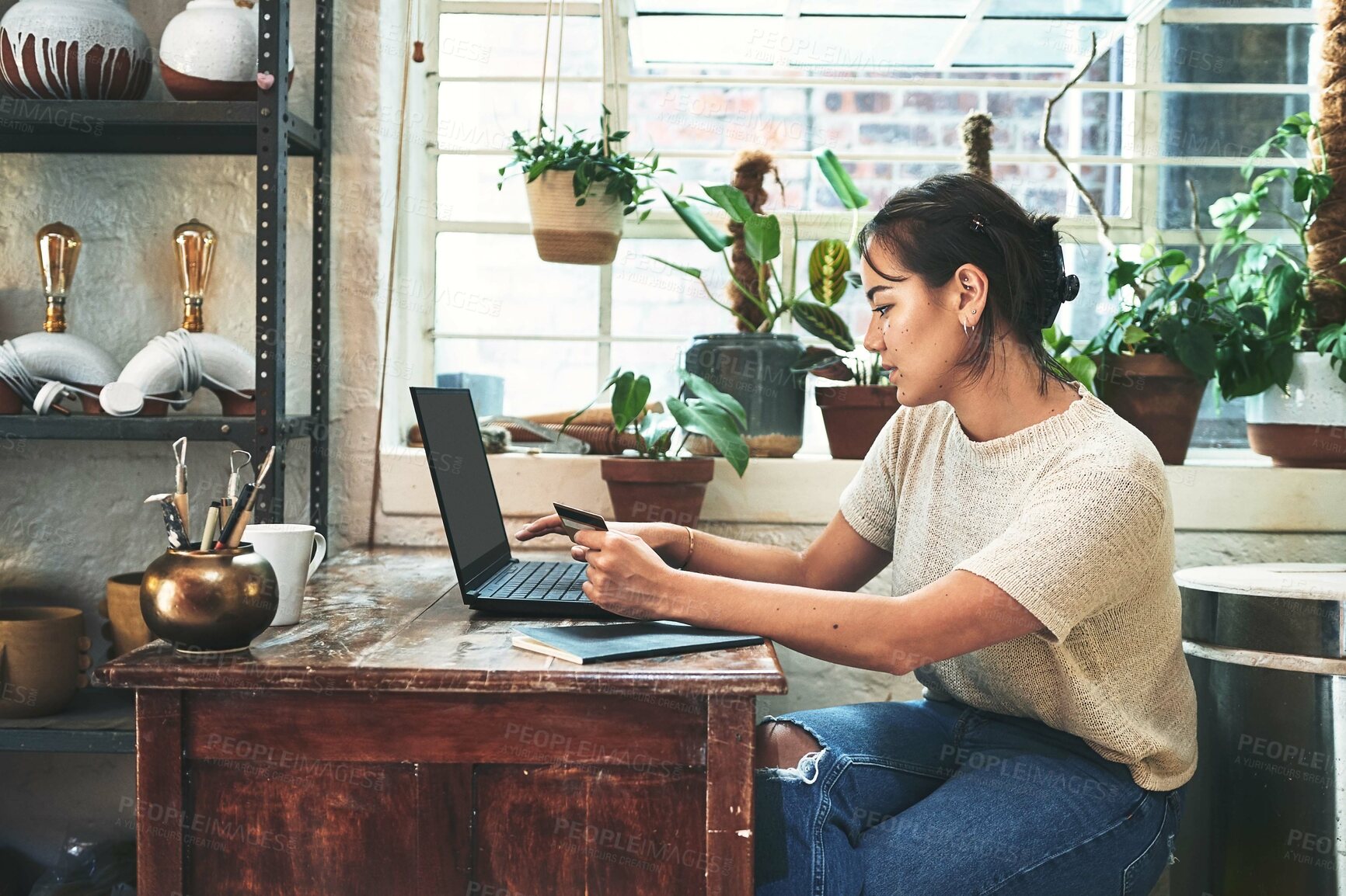 Buy stock photo Laptop, credit card and pottery with woman in studio for ceramic inventory, clay and payment. Small business, sculptor supply and artist with person in workshop for gallery invoice, order and startup