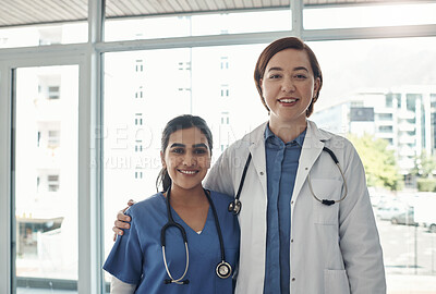 Buy stock photo Portrait, women and doctors in clinic, hug and confidence with pride, professional and cooperation. Face, people and medical with teamwork, nurse and mentor with intern, collaboration and hospital