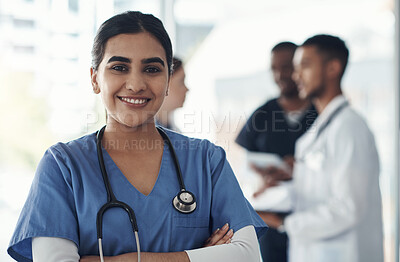 Buy stock photo Portrait, confident nurse and happy woman in hospital for healthcare career, wellness and proud doctor. Face, smile and medical professional with arms crossed, surgeon or expert employee coworking