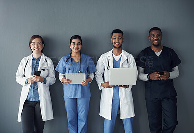 Buy stock photo Doctor, teamwork and technology on wall background for research, planning and multimedia workflow. Healthcare worker, group and nurse in portrait with laptop, tablet and phone for contact or about us