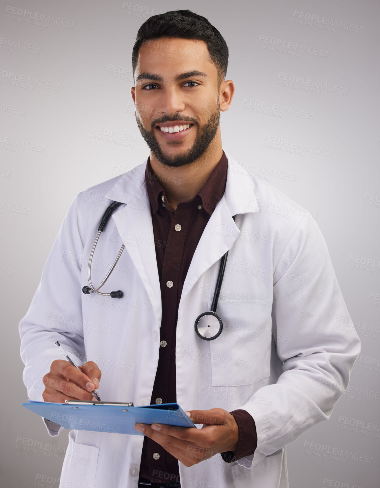 Buy stock photo Doctor, studio portrait and man with clipboard for patient report, consultation notes and test results. Male medical worker, stethoscope and document for surgery, healthcare advice and administration