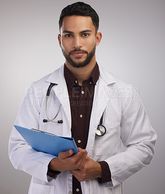 Buy stock photo Doctor, studio portrait and man with document for patient report, consultation notes and test results. Male medical worker, clipboard and checklist for surgery with healthcare and admin on backdrop