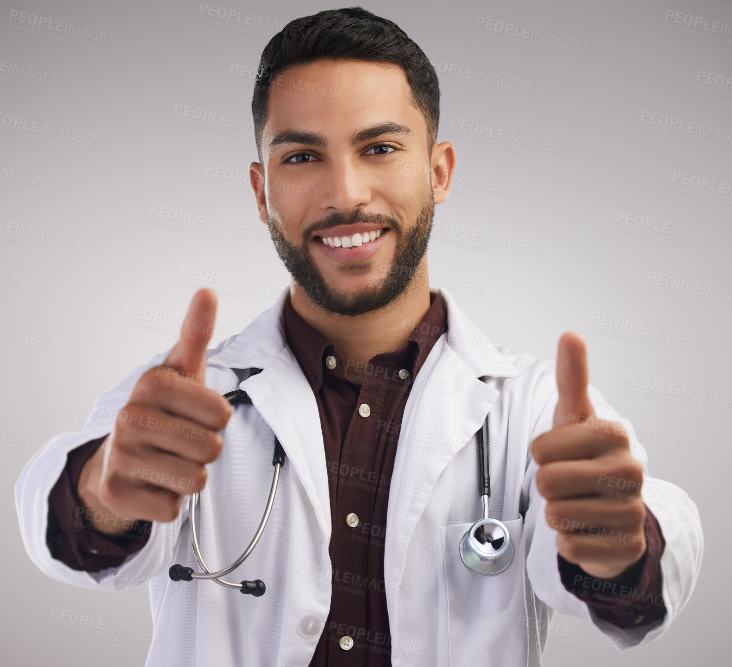 Buy stock photo Doctor, studio portrait and man with thumbs up for health, good news and positive test results by white background. Male medical worker, hands and yes emoji for surgery success, agreement and goals