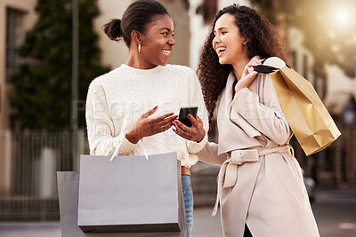 Buy stock photo Smartphone, women and happy with paper bag for online shopping, sale and retail together outdoor by mall. People, product and cellphone for ecommerce, discount and deal for fashion or luxury clothes