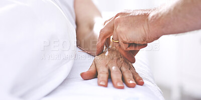 Buy stock photo An unrecognizable woman getting needles inserted into her hand during an acupuncture session. Closeup of patient getting alternative therapy for medical treatment
