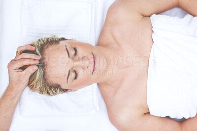 Buy stock photo A young woman getting needles inserted into her head during an acupuncture session. A patient getting alternative therapy for medical treatment