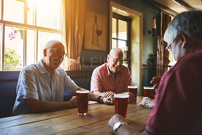 Buy stock photo Group of senior men sitting together in a bar, bonding, senior friends enjoying a day in a pub