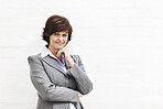 Portrait of a businesswoman, isolated on a white background. A mature female executive looking confident about business in an office or studio