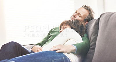 Buy stock photo A mature couple sleeping at home. A happy senior man and woman having a nap, sharing a comfortable moment on the couch