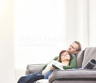 Buy stock photo A mature couple sleeping at home. A happy senior man and woman having a nap, sharing a comfortable moment on the couch