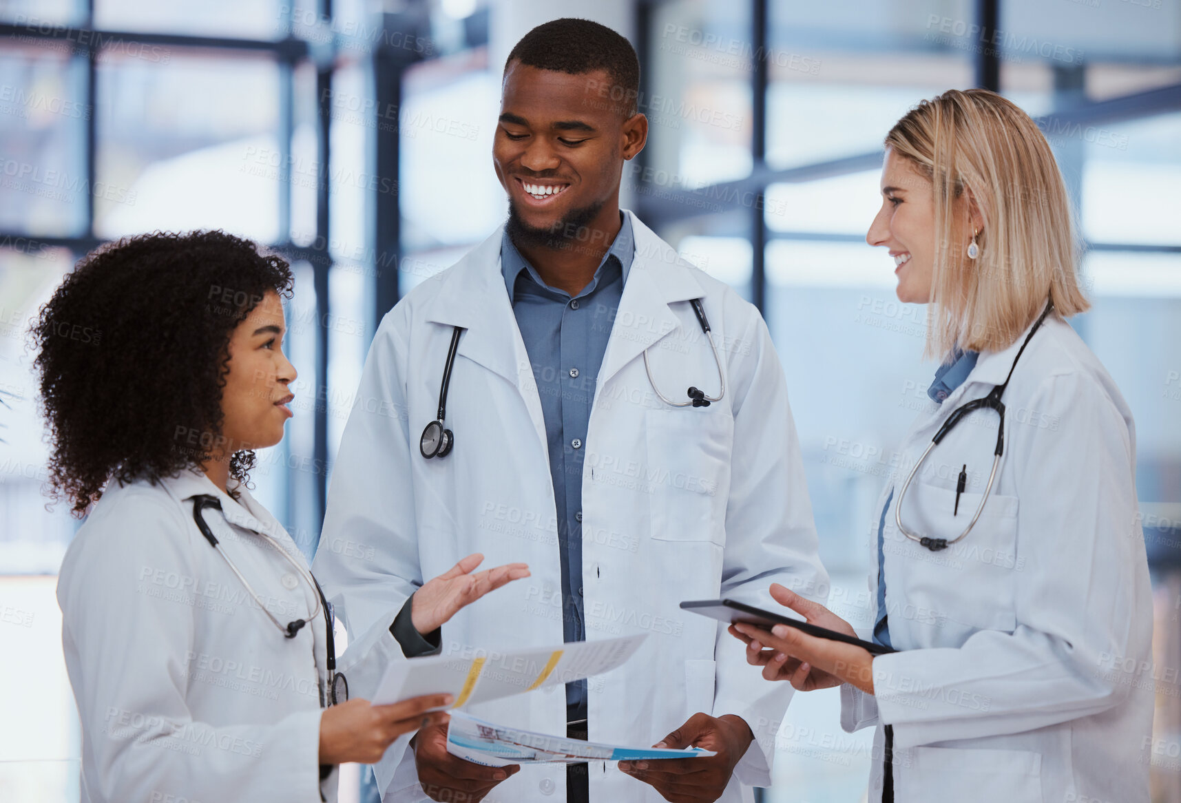 Buy stock photo Collaboration, conversation and medical consulting with doctors in hospital for advice on documents, checklist and health. Communication, consultation or support with team of healthcare professionals