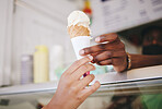 Hands, ice cream and woman buying icecream cone at a shop, local and small business support. Sugar, dessert and person purchase snack from seller to enjoy on summer day as a frozen sweet in the city